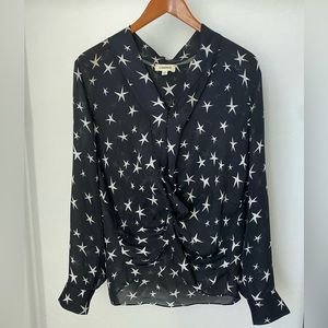 L’Agence button star top